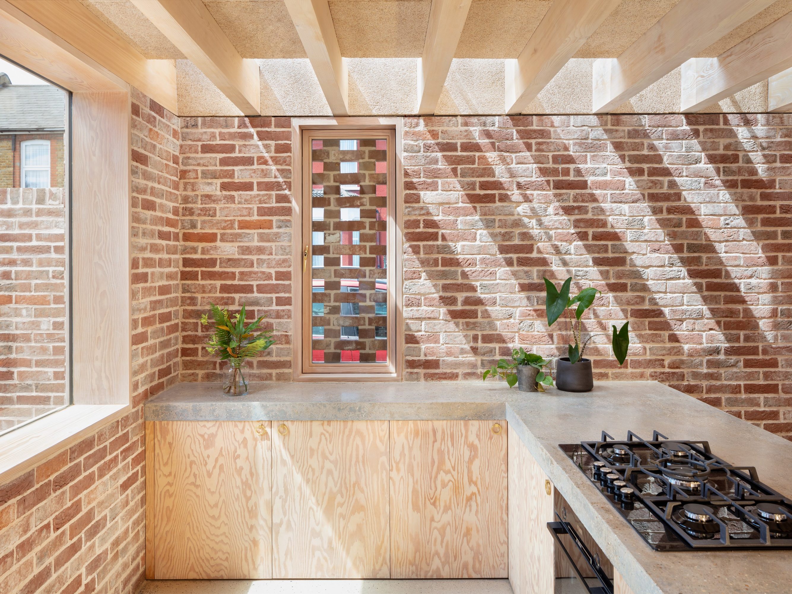 Leyton House. Brick Award 22 Category "Feeling at home". McMahon Architecture. Internal view of kitchen towards main external brick elevation