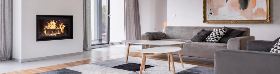 Modern living room with fireplace, sofa, balcony and pattern carpet, panorama